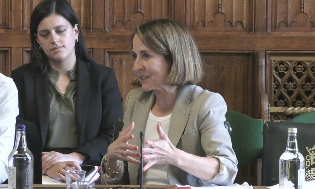 Former UK privacy chief preparing legal action against woman who reported him, minister says